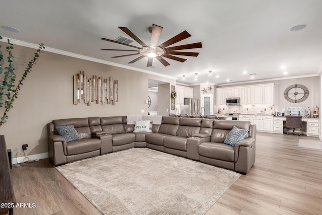 1179 E Regent Dr, Gilbert, AZ 85298 - living room featuring ceiling fan, crown molding, light wood-type flooring, and baseboards