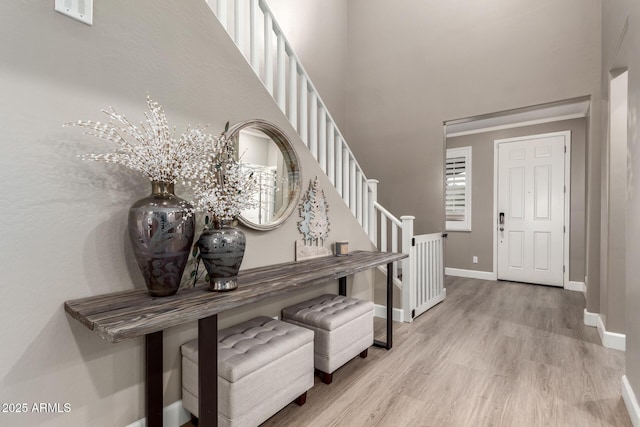1179 E Regent Dr, Gilbert, AZ 85298 - entrance foyer with baseboards, wood finished floors, a towering ceiling, and stairs