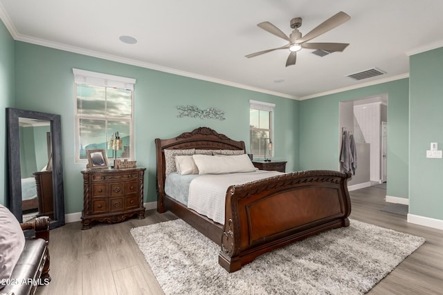 1179 E Regent Dr, Gilbert, AZ 85298 - bedroom with crown molding, wood finished floors, baseboards, and a ceiling fan