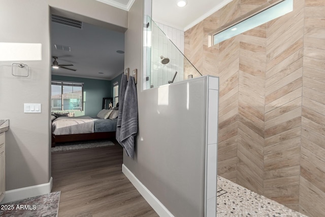 1179 E Regent Dr, Gilbert, AZ 85298 - ensuite bathroom with ornamental molding, a walk in shower, ceiling fan, baseboards, and wood finished floors