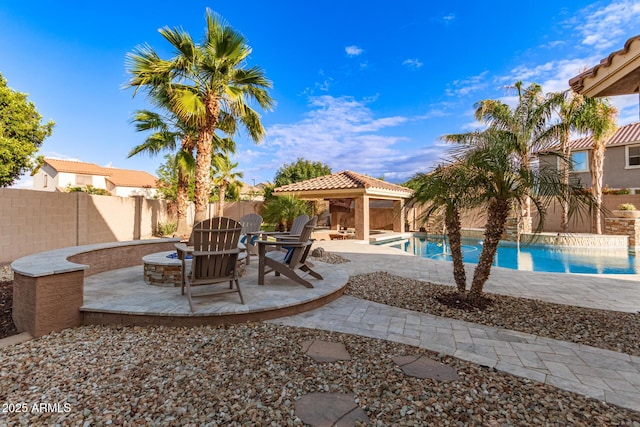 1179 E Regent Dr, Gilbert, AZ 85298 - view of patio / terrace featuring a gazebo, a fire pit, and a fenced backyard