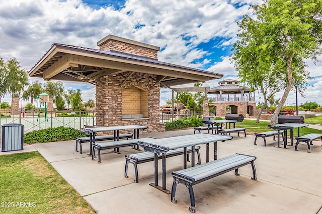 1179 E Regent Dr, Gilbert, AZ 85298 - surrounding community featuring a gazebo, fence, a patio area, and outdoor dining space