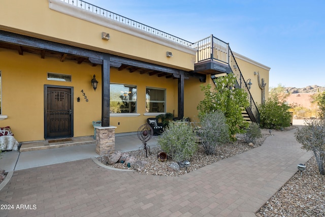 exterior space with a balcony and a mountain view