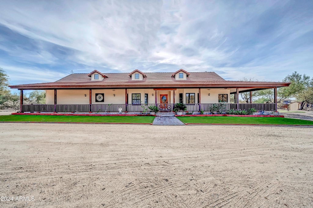 farmhouse inspired home with covered porch