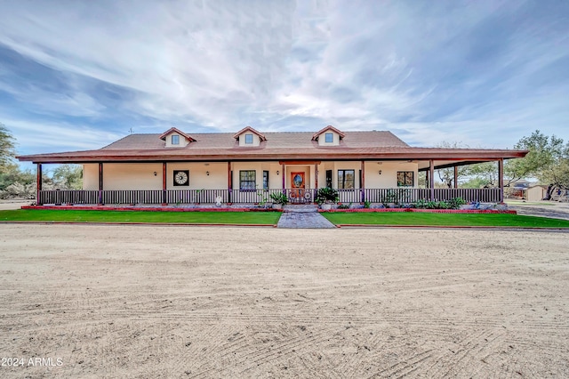 farmhouse inspired home with covered porch