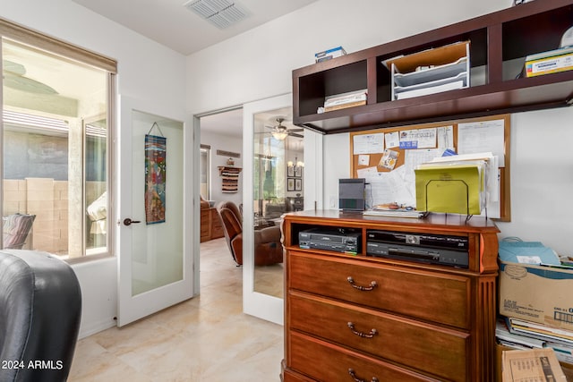 home office featuring french doors, ceiling fan, and a healthy amount of sunlight