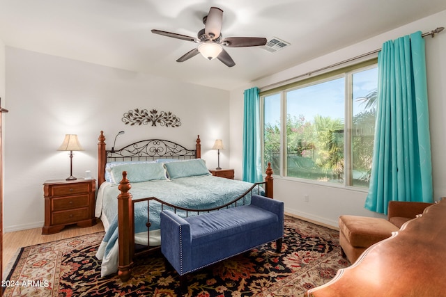 bedroom featuring hardwood / wood-style floors and ceiling fan