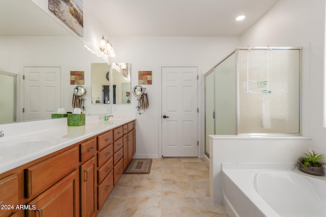 bathroom with vanity, tile patterned floors, and separate shower and tub