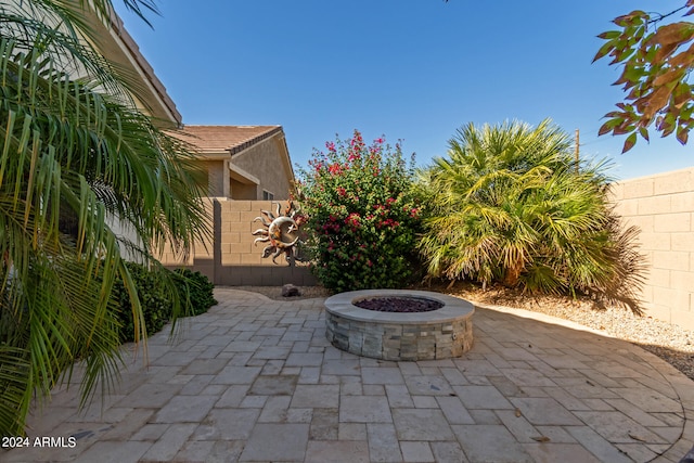 view of patio / terrace with an outdoor fire pit