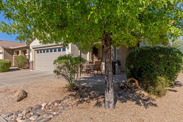 obstructed view of property featuring a garage