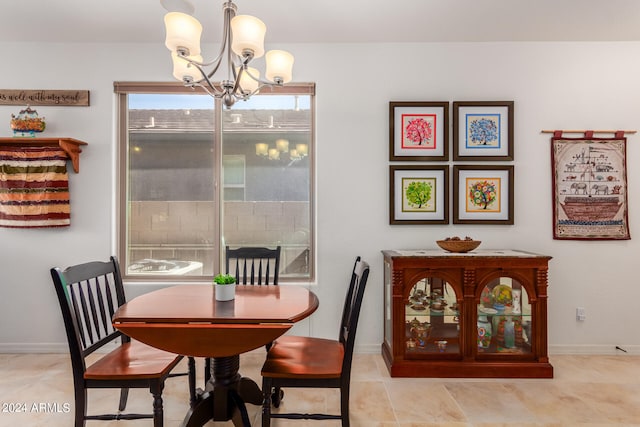 dining space featuring an inviting chandelier