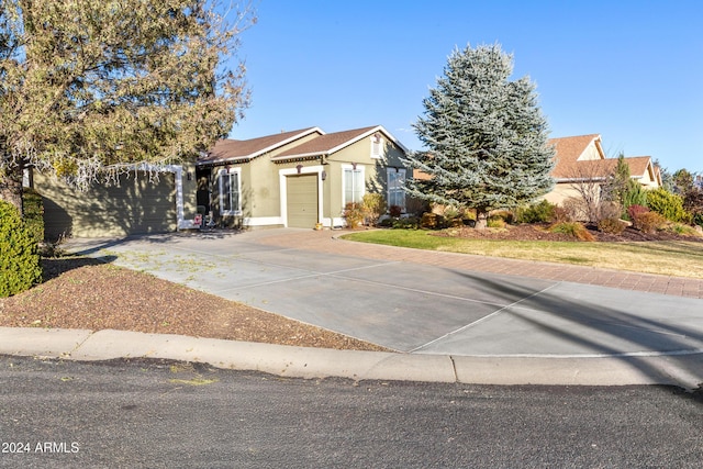 view of front of property featuring a garage