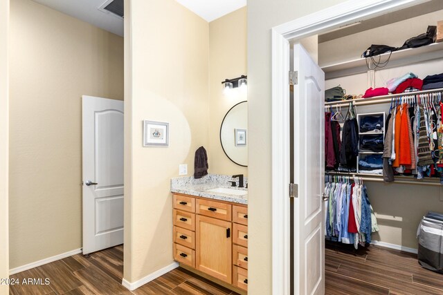 bathroom featuring hardwood / wood-style floors and vanity