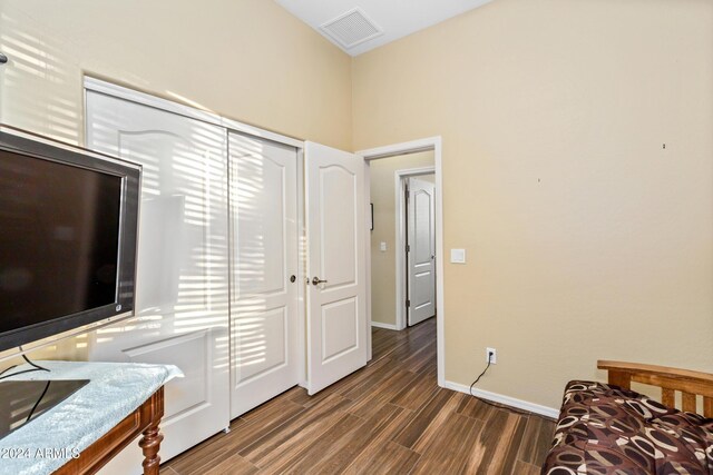 bedroom featuring dark hardwood / wood-style flooring