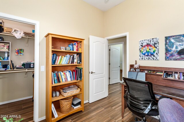 office space with dark wood-type flooring