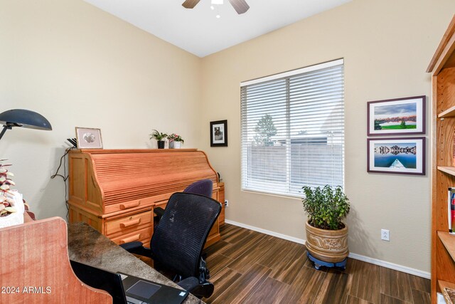 home office featuring dark hardwood / wood-style floors, ceiling fan, and a healthy amount of sunlight