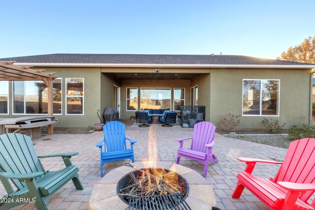 view of patio featuring a fire pit