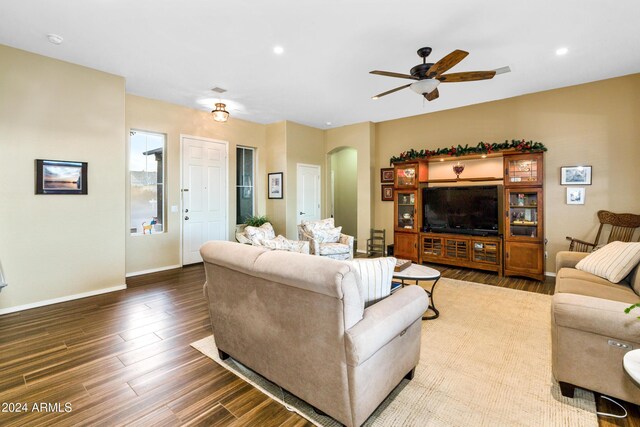 living room with ceiling fan and wood-type flooring