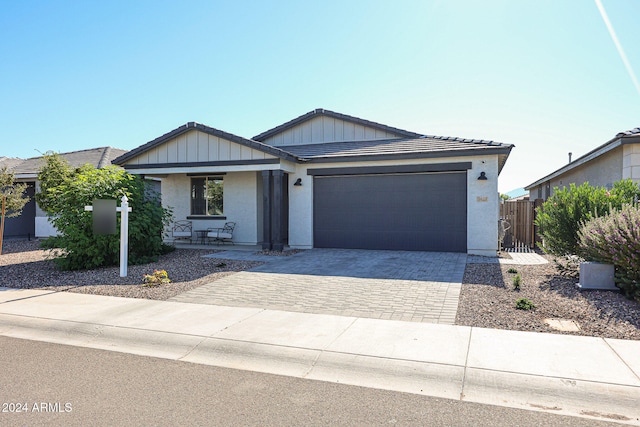 single story home featuring a garage