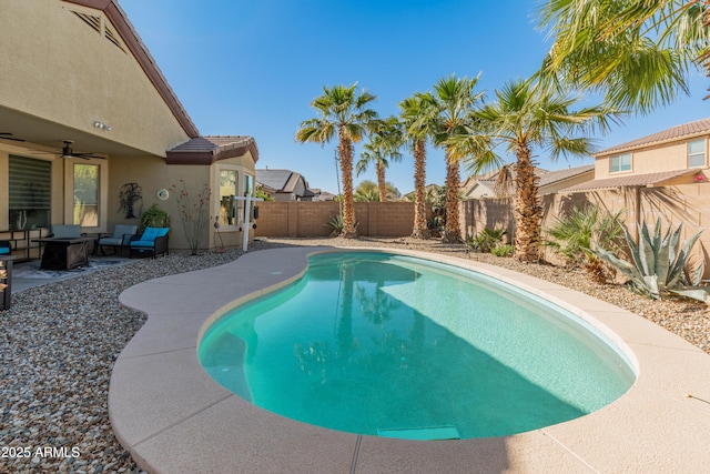 view of pool featuring a fenced backyard, a patio, and ceiling fan