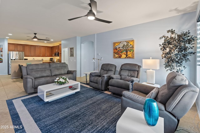 living area featuring light tile patterned floors, ceiling fan, and recessed lighting