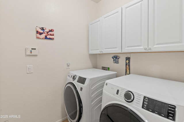 laundry area featuring cabinet space, baseboards, and independent washer and dryer