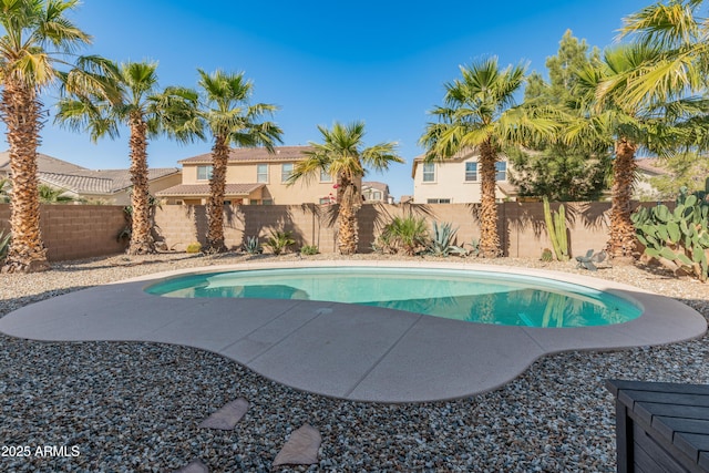 view of pool featuring a patio area, a fenced backyard, and a fenced in pool