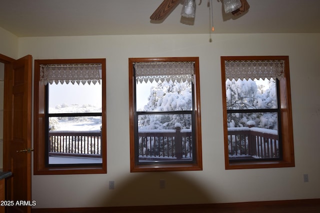 interior details featuring a ceiling fan