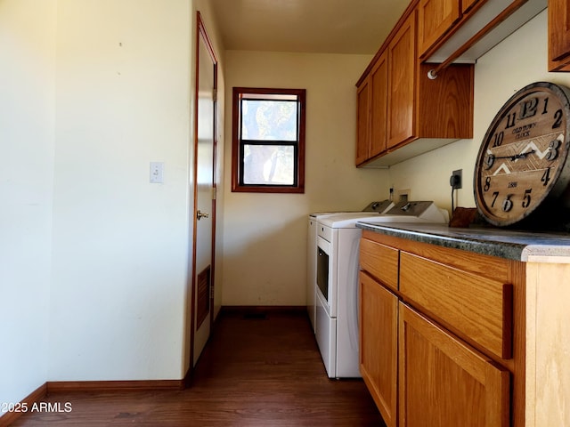 laundry room with baseboards, cabinet space, dark wood-type flooring, and independent washer and dryer