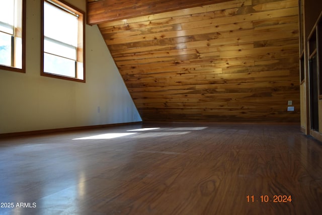 empty room featuring dark wood-style floors and wood walls