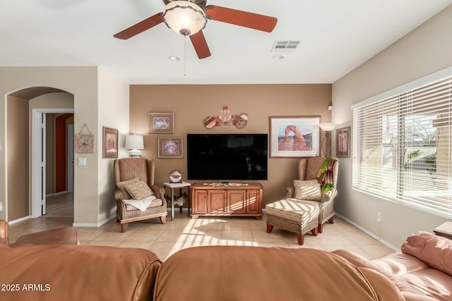 living room with ceiling fan and light tile patterned floors