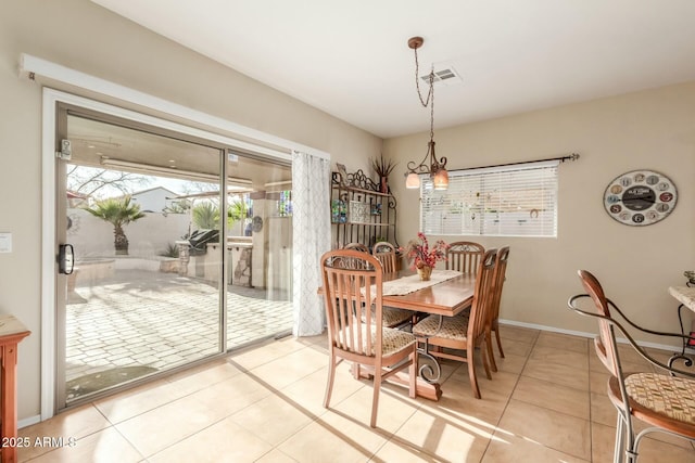 dining room featuring light tile patterned floors and a wealth of natural light