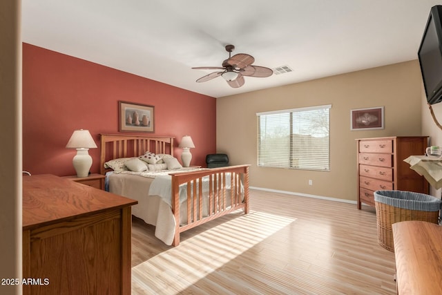 bedroom featuring ceiling fan and light hardwood / wood-style flooring