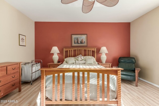 bedroom featuring ceiling fan and light wood-type flooring