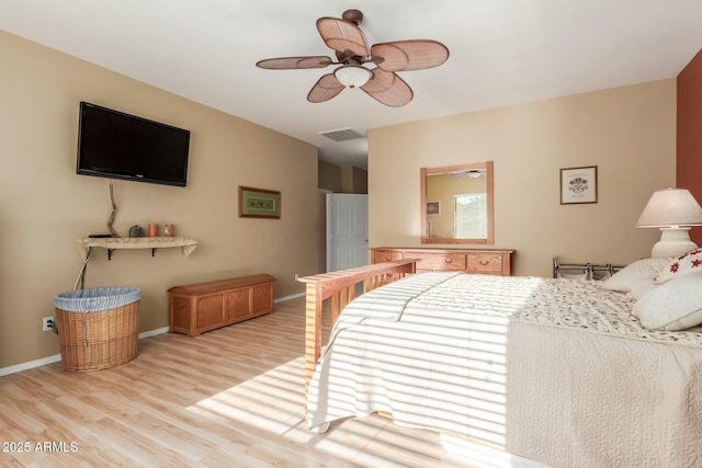 bedroom with ceiling fan and light hardwood / wood-style floors