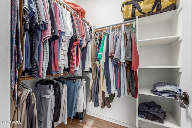 spacious closet featuring hardwood / wood-style floors