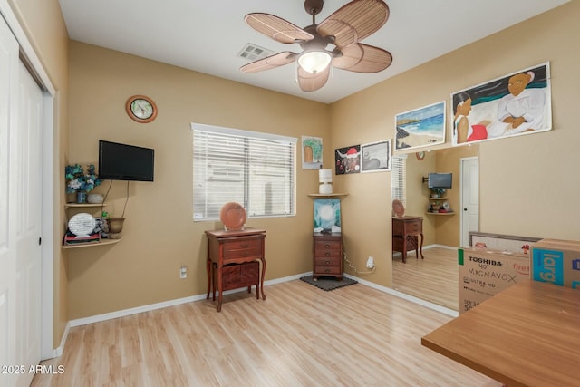 miscellaneous room with ceiling fan and light hardwood / wood-style floors