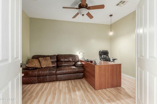 office featuring light hardwood / wood-style floors and ceiling fan