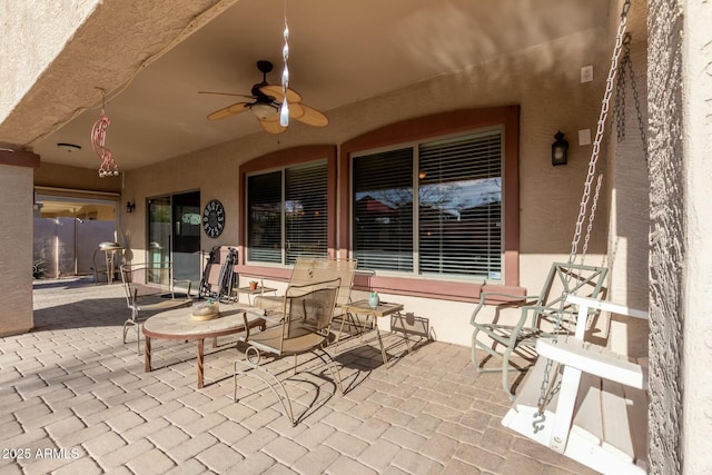 view of patio with ceiling fan