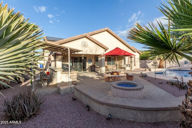 view of patio / terrace with an outdoor fire pit