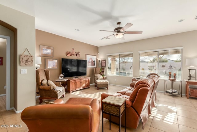 living room featuring ceiling fan and light tile patterned flooring