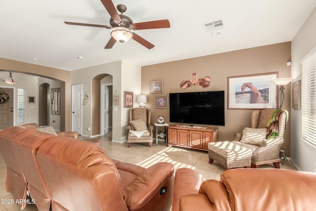 living room with ceiling fan and light tile patterned floors