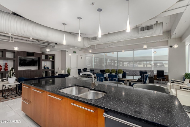 1 E Lexington Ave Unit 1108, Phoenix, AZ 85012 - kitchen with a sink, brown cabinets, open floor plan, modern cabinets, and dishwasher