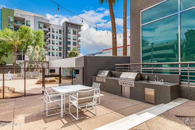 1 E Lexington Ave Unit 1108, Phoenix, AZ 85012 - view of patio with a sink and outdoor dining space
