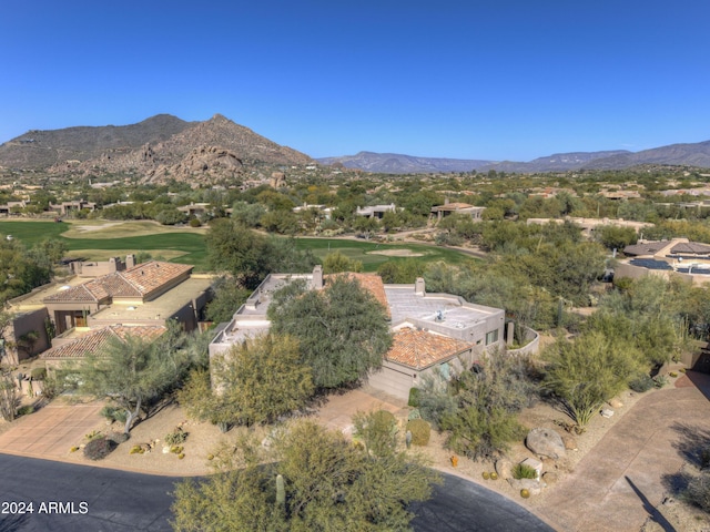 birds eye view of property with a mountain view