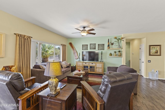 living room with ceiling fan and dark hardwood / wood-style flooring