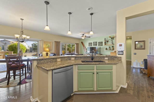 kitchen featuring dark hardwood / wood-style flooring, light stone countertops, sink, and stainless steel dishwasher