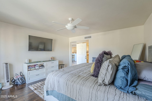 bedroom featuring ceiling fan and dark hardwood / wood-style floors