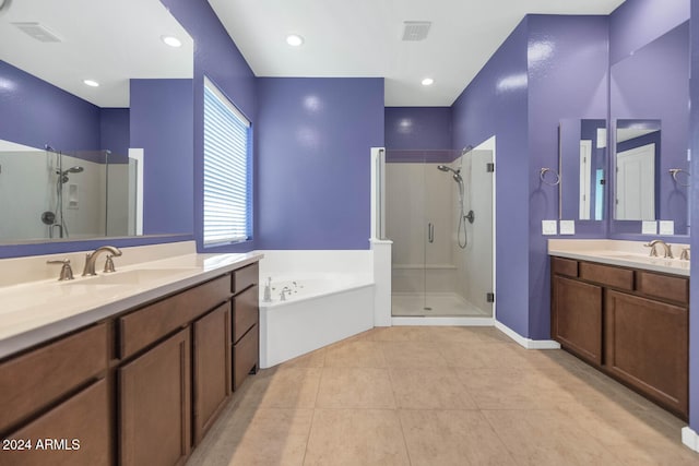 bathroom with vanity, tile patterned flooring, and independent shower and bath