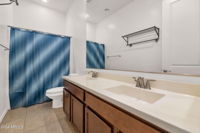 bathroom with vanity, tile patterned floors, toilet, and a shower with shower curtain